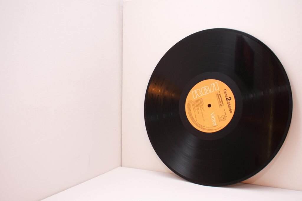 A close-up image of a black vinyl record with an RCA label against a white background.